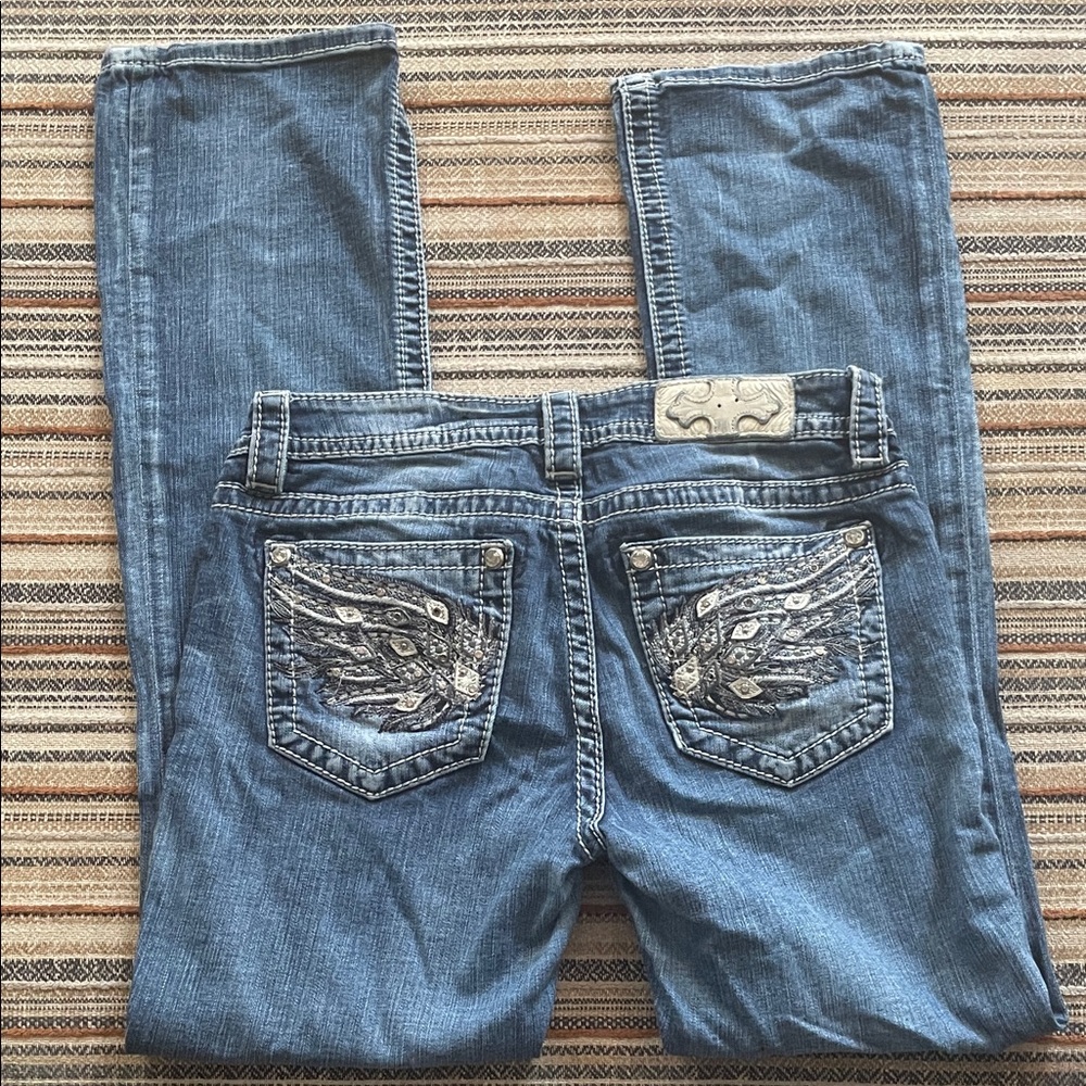 Miss Me mid rise  Boot Cut Jeans with their iconic Embellished back Pockets